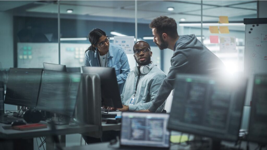 three people discussing managed IT support in NYC