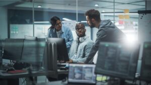 three people discussing managed IT support in NYC