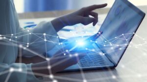 person using laptop working on network management