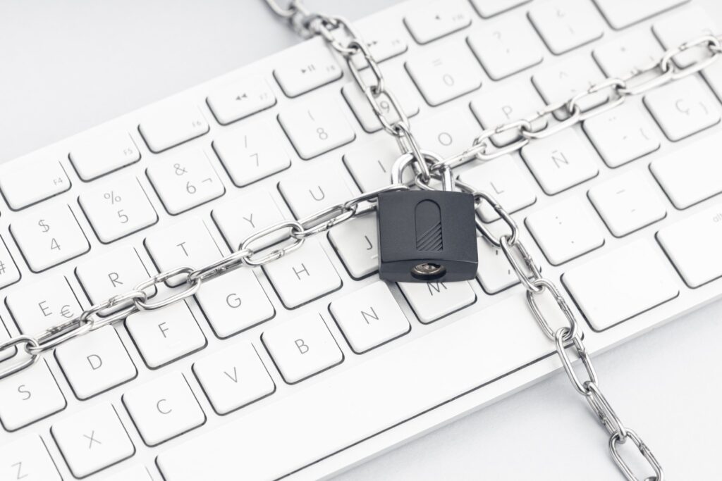 padlock and chain around a mac keyboard