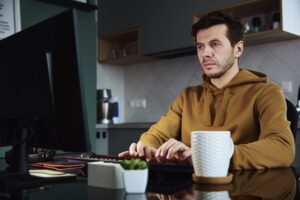 a man working from home using a computer
