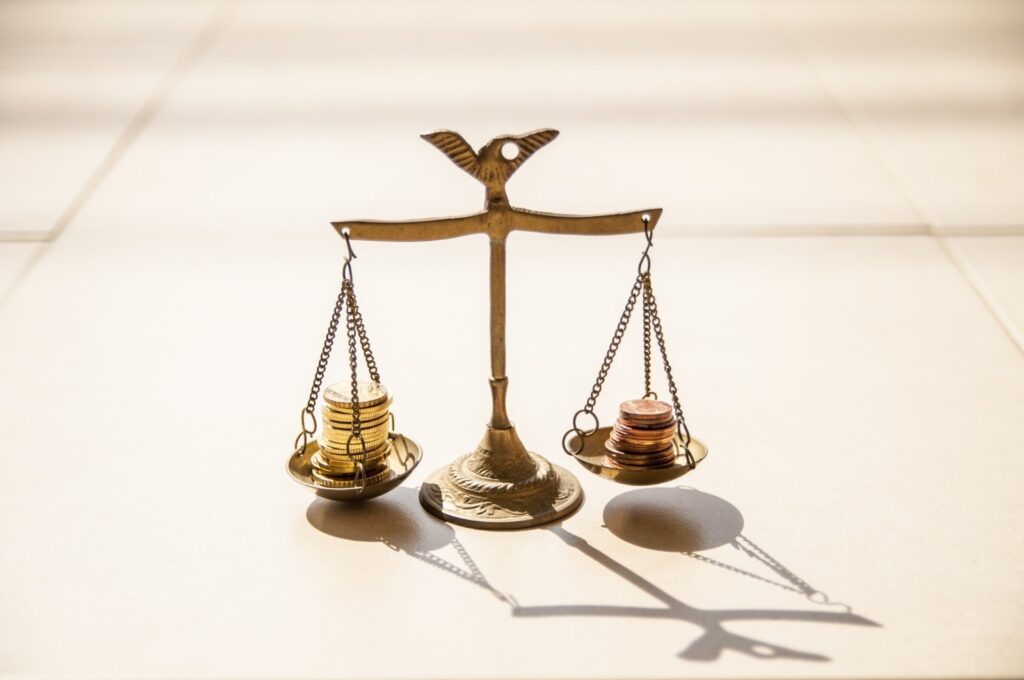 scales with coins balanced on them