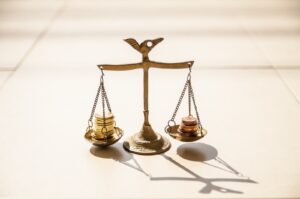 scales with coins balanced on them
