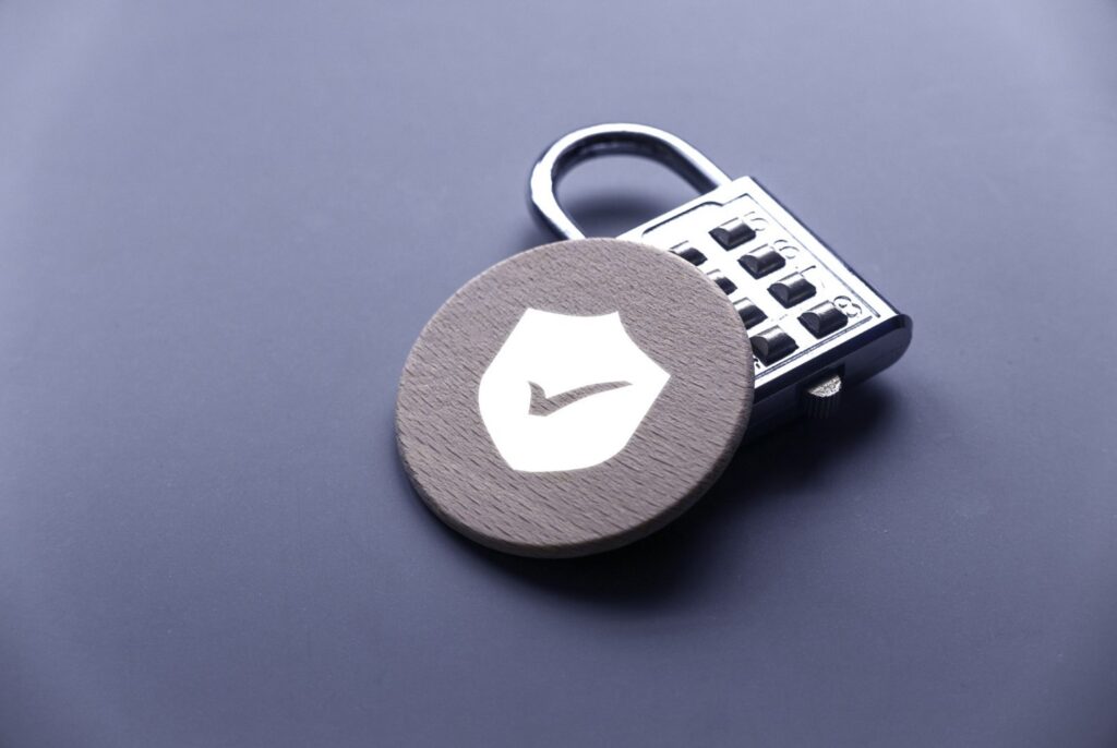 a padlock next to a wooden counter with a tick on it