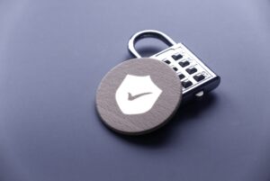 a padlock next to a wooden counter with a tick on it