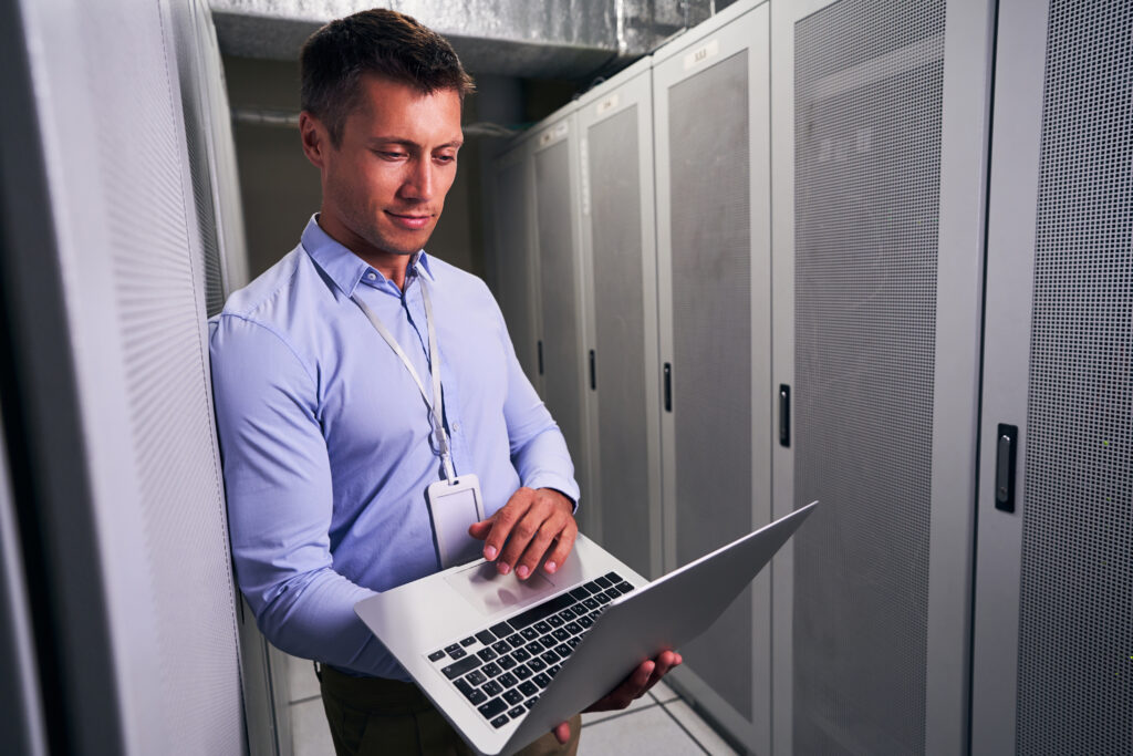 data centre engineer working on notebook computer
